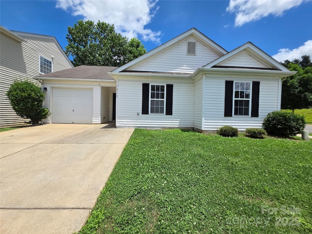 7315 Fig Ln, Charlotte, NC 28215 - view of front of home with an attached garage, driveway, and a front lawn