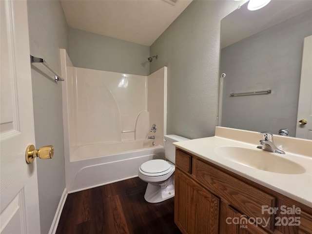 7315 Fig Ln, Charlotte, NC 28215 - full bathroom with wood finished floors, vanity, and shower / bathtub combination