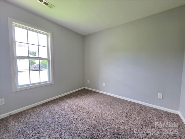 7315 Fig Ln, Charlotte, NC 28215 - spare room with carpet floors and baseboards