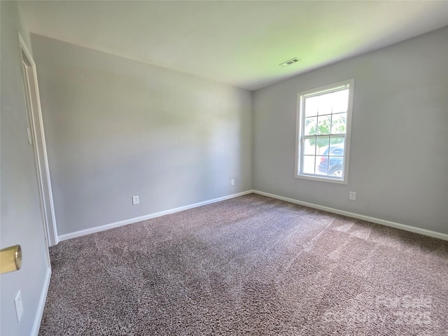 7315 Fig Ln, Charlotte, NC 28215 - unfurnished room with carpet flooring and baseboards