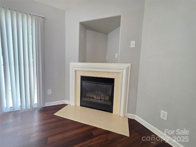 7315 Fig Ln, Charlotte, NC 28215 - detailed view of wood finished floors and a glass covered fireplace