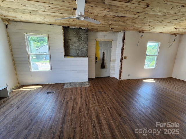 1004 S Ridge Ave, Kannapolis, NC 28083 - unfurnished living room featuring healthy amount of natural light, wooden ceiling, wood finished floors, and a ceiling fan