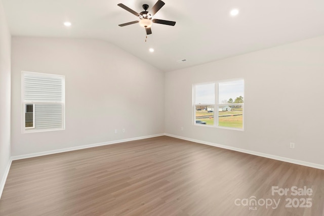 1060 Russell Dr, Winston Salem, NC 27127 - spare room with recessed lighting, wood finished floors, a ceiling fan, and lofted ceiling