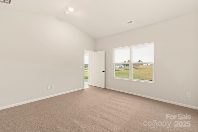 1060 Russell Dr, Winston Salem, NC 27127 - carpeted spare room with vaulted ceiling and baseboards