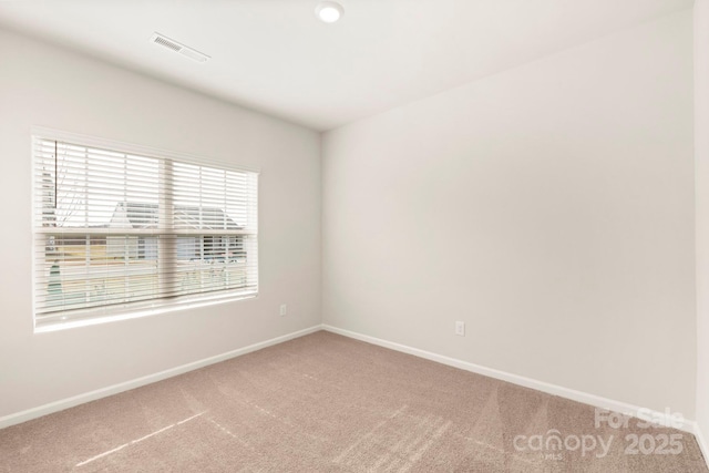 1060 Russell Dr, Winston Salem, NC 27127 - spare room featuring carpet and baseboards