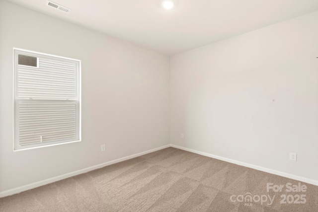 1060 Russell Dr, Winston Salem, NC 27127 - empty room with light carpet and baseboards