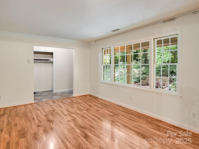 8 Mayfair Dr, Candler, NC 28715 - unfurnished bedroom featuring light wood finished floors and a closet