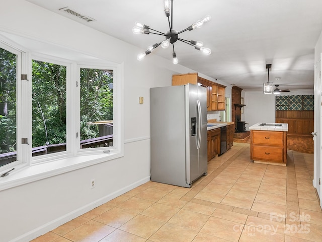 8 Mayfair Dr, Candler, NC 28715 - kitchen with stainless steel fridge, tile counters, a chandelier, dishwasher, and light tile patterned floors