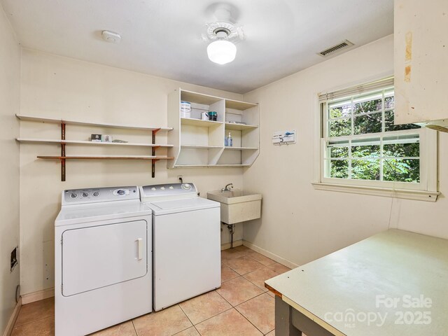 8 Mayfair Dr, Candler, NC 28715 - laundry area featuring washing machine and dryer and light tile patterned flooring