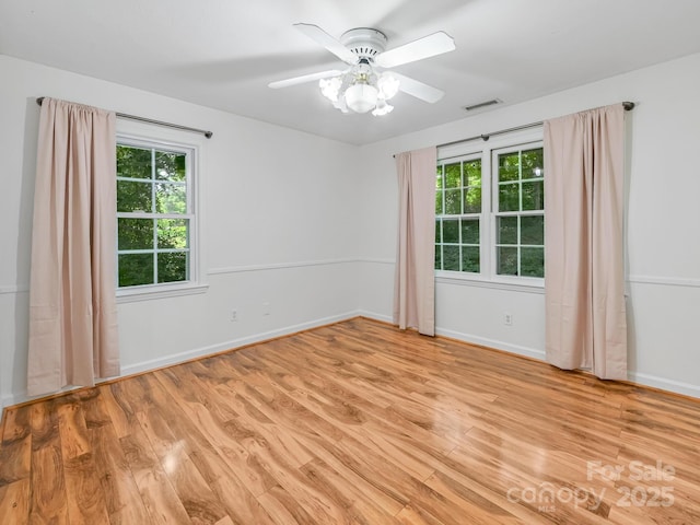8 Mayfair Dr, Candler, NC 28715 - empty room with light wood finished floors and a ceiling fan