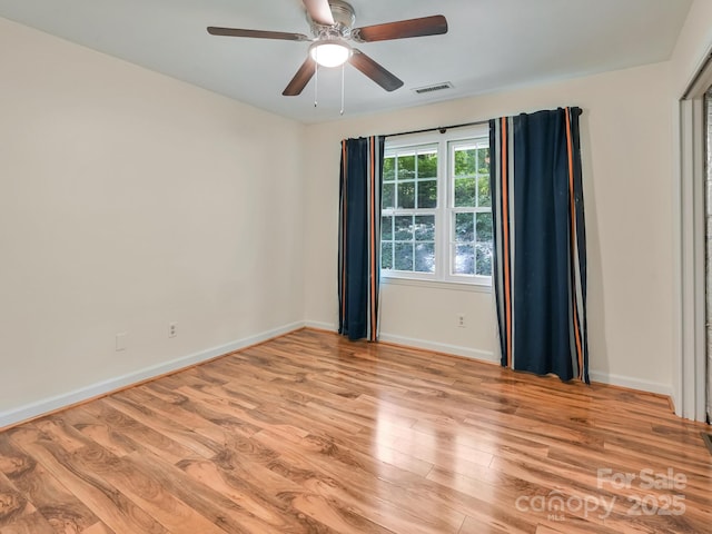 8 Mayfair Dr, Candler, NC 28715 - unfurnished room with light wood finished floors and a ceiling fan