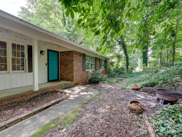 8 Mayfair Dr, Candler, NC 28715 - view of exterior entry with brick siding
