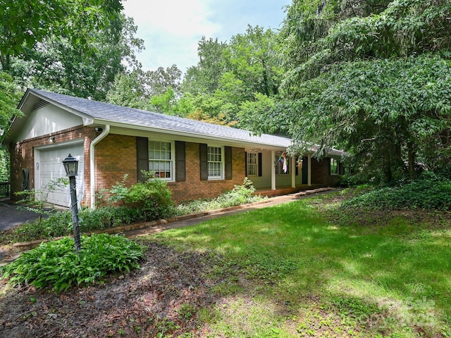 8 Mayfair Dr, Candler, NC 28715 - single story home featuring brick siding, an attached garage, a front yard, driveway, and roof with shingles