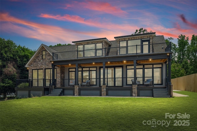 5985 Natoma Rd, Clover, SC 29710 - back of property with a balcony, stone siding, and a ceiling fan