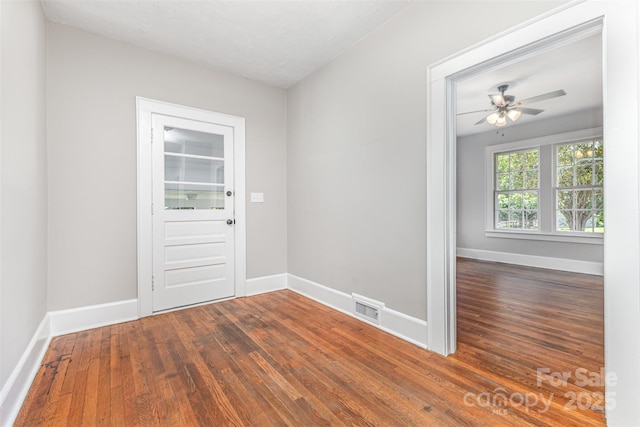 309 E Main St, Lattimore, NC 28089 - doorway to outside with dark wood-style floors and ceiling fan