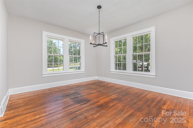 309 E Main St, Lattimore, NC 28089 - spare room with a chandelier, healthy amount of natural light, and hardwood / wood-style floors