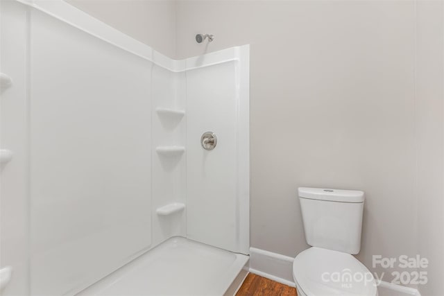 309 E Main St, Lattimore, NC 28089 - bathroom featuring a shower and wood finished floors