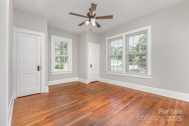 309 E Main St, Lattimore, NC 28089 - spare room with hardwood / wood-style flooring and a ceiling fan