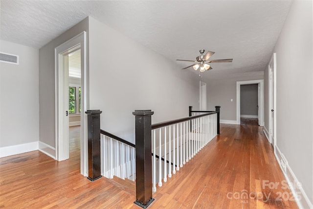 309 E Main St, Lattimore, NC 28089 - hall with an upstairs landing, hardwood / wood-style flooring, and a textured ceiling