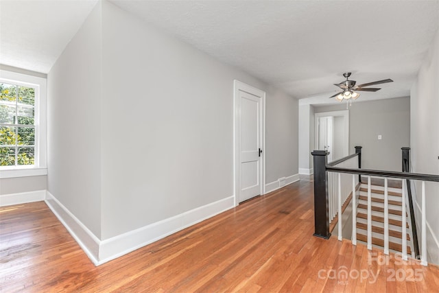 309 E Main St, Lattimore, NC 28089 - corridor with an upstairs landing and light wood-type flooring