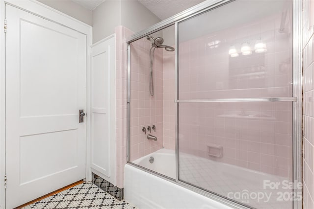 309 E Main St, Lattimore, NC 28089 - full bath with combined bath / shower with glass door and tile patterned flooring