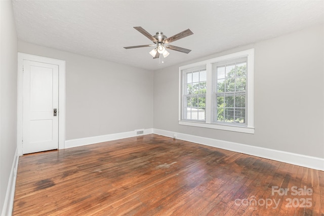 309 E Main St, Lattimore, NC 28089 - unfurnished room with hardwood / wood-style flooring and a ceiling fan