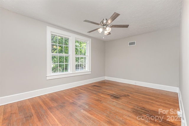 309 E Main St, Lattimore, NC 28089 - spare room with a ceiling fan and hardwood / wood-style flooring