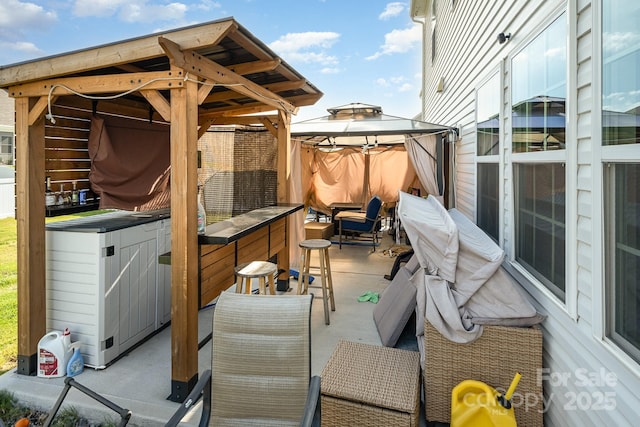 5580 Soft Shell Dr, Lancaster, SC 29720 - view of patio featuring a gazebo, a hot tub, and an outdoor hangout area