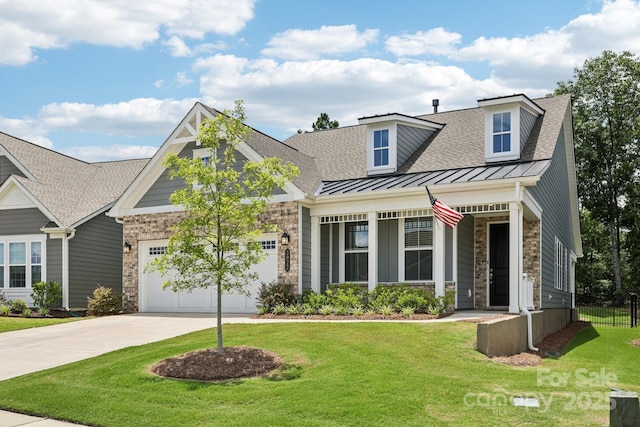 3022 Trace Meadow Ct, York, SC 29745 - view of front of home with stone siding, a standing seam roof, an attached garage, concrete driveway, and a shingled roof