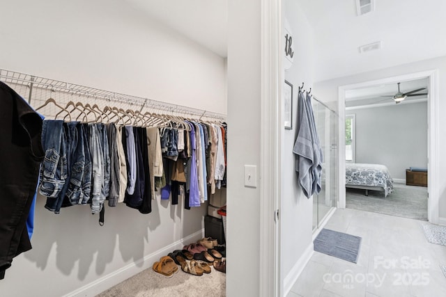 3022 Trace Meadow Ct, York, SC 29745 - walk in closet with carpet floors, a ceiling fan, and tile patterned flooring