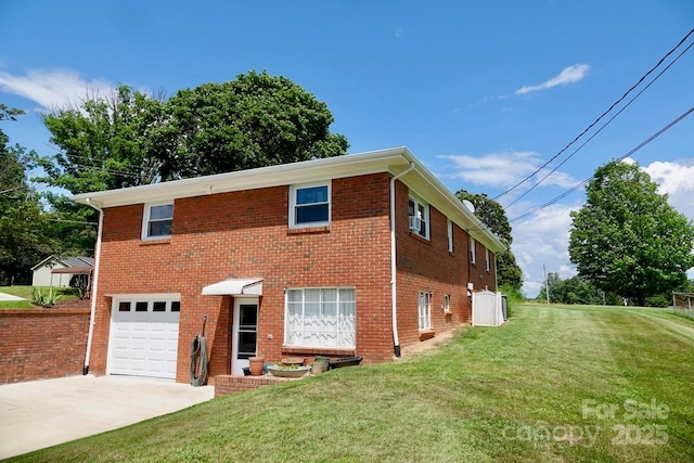 795 Monte Vista Rd, Candler, NC 28715 - traditional-style house featuring an attached garage, concrete driveway, a front yard, and brick siding