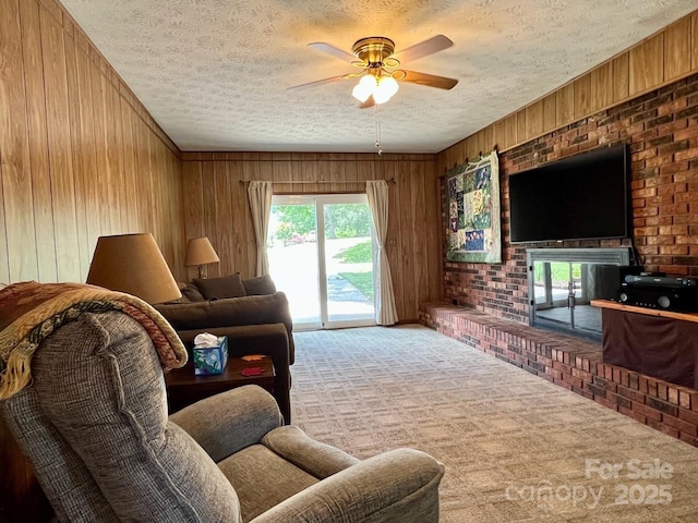 795 Monte Vista Rd, Candler, NC 28715 - carpeted living room with a textured ceiling, wooden walls, and ceiling fan