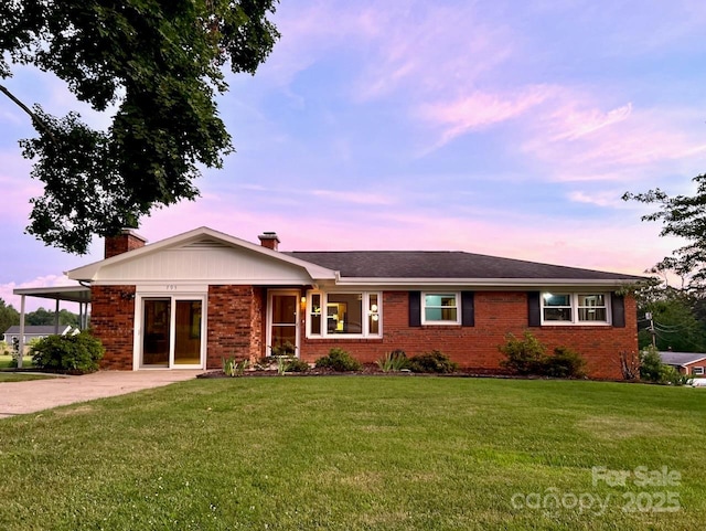 795 Monte Vista Rd, Candler, NC 28715 - ranch-style house with a chimney, brick siding, and a lawn