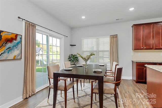 7079 Waterwheel St SW, Concord, NC 28025 - dining space featuring light wood-style floors and recessed lighting