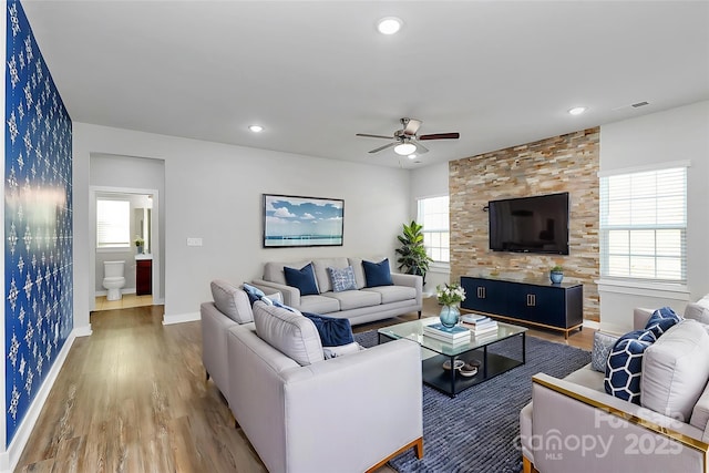 7079 Waterwheel St SW, Concord, NC 28025 - living room featuring a ceiling fan, wood finished floors, healthy amount of natural light, and recessed lighting