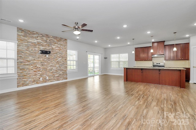 7079 Waterwheel St SW, Concord, NC 28025 - kitchen with open floor plan, electric range, under cabinet range hood, a ceiling fan, and recessed lighting