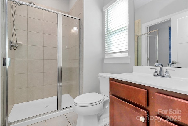 7079 Waterwheel St SW, Concord, NC 28025 - bathroom featuring vanity, a shower stall, and tile patterned flooring
