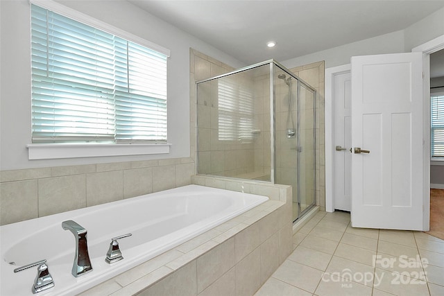 7079 Waterwheel St SW, Concord, NC 28025 - full bath with a bath, tile patterned floors, a stall shower, healthy amount of natural light, and recessed lighting