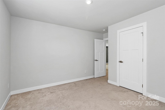 7079 Waterwheel St SW, Concord, NC 28025 - unfurnished bedroom featuring light carpet and baseboards