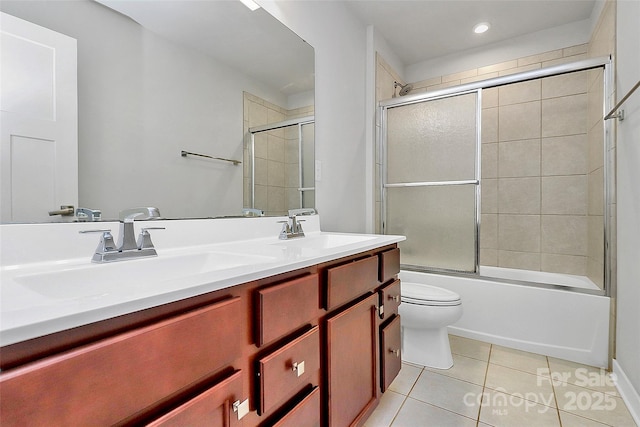 7079 Waterwheel St SW, Concord, NC 28025 - bathroom with tile patterned flooring, double vanity, shower / bath combination with glass door, and recessed lighting