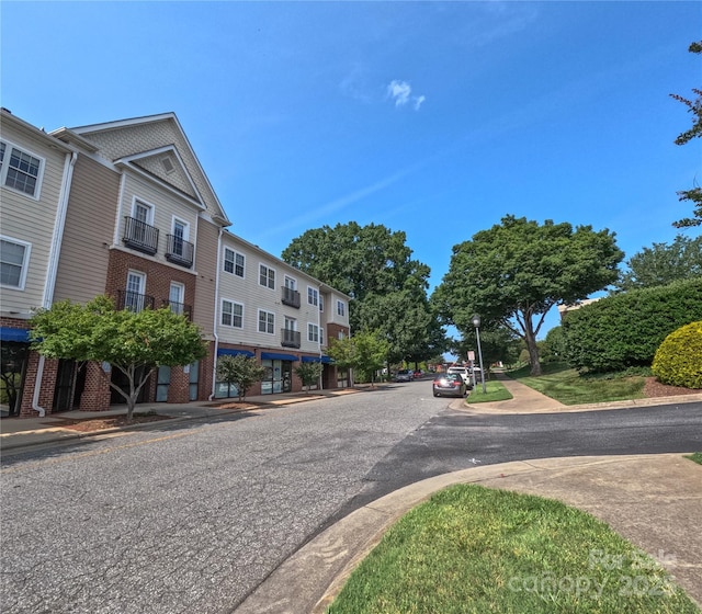 1410 4th Street Dr NW Unit 303, Hickory, NC 28601 - view of asphalt street with curbs, street lights, and sidewalks