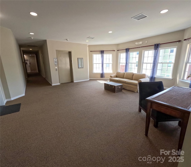 1410 4th Street Dr NW Unit 303, Hickory, NC 28601 - living area featuring elevator, carpet floors, and recessed lighting