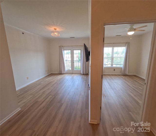 1410 4th Street Dr NW Unit 303, Hickory, NC 28601 - unfurnished room with wood finished floors, french doors, and ceiling fan