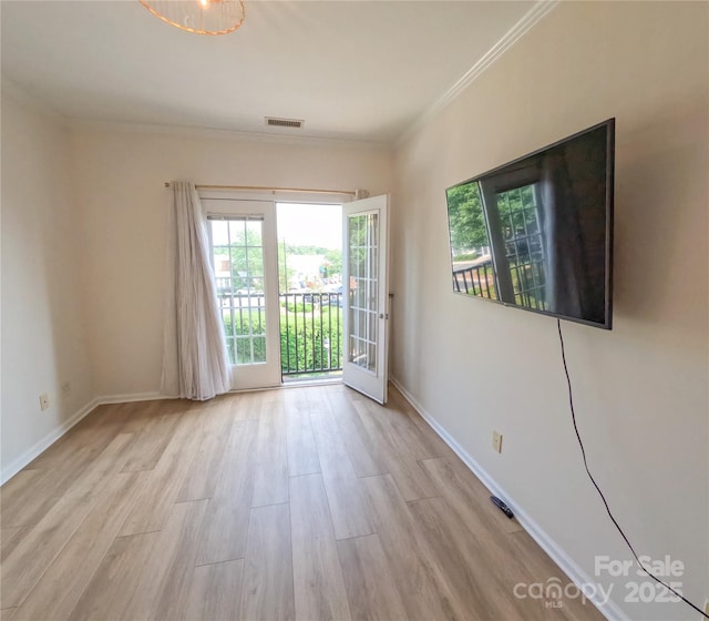 1410 4th Street Dr NW Unit 303, Hickory, NC 28601 - empty room with wood finished floors and ornamental molding