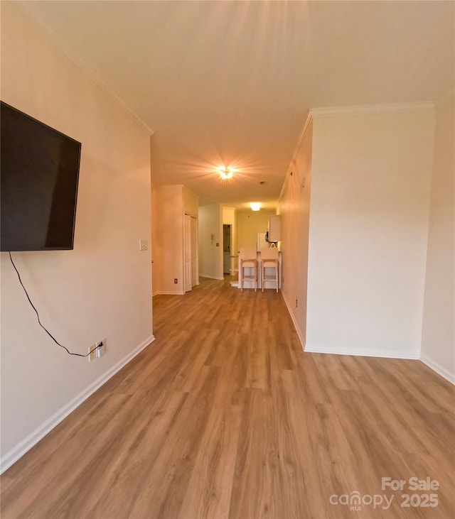 1410 4th Street Dr NW Unit 303, Hickory, NC 28601 - unfurnished living room featuring ornamental molding and wood finished floors