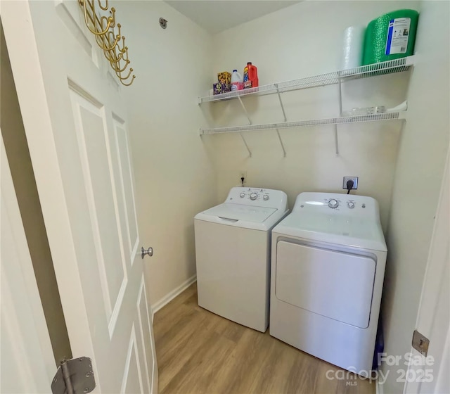 1410 4th Street Dr NW Unit 303, Hickory, NC 28601 - washroom featuring light wood-style floors and washer and dryer