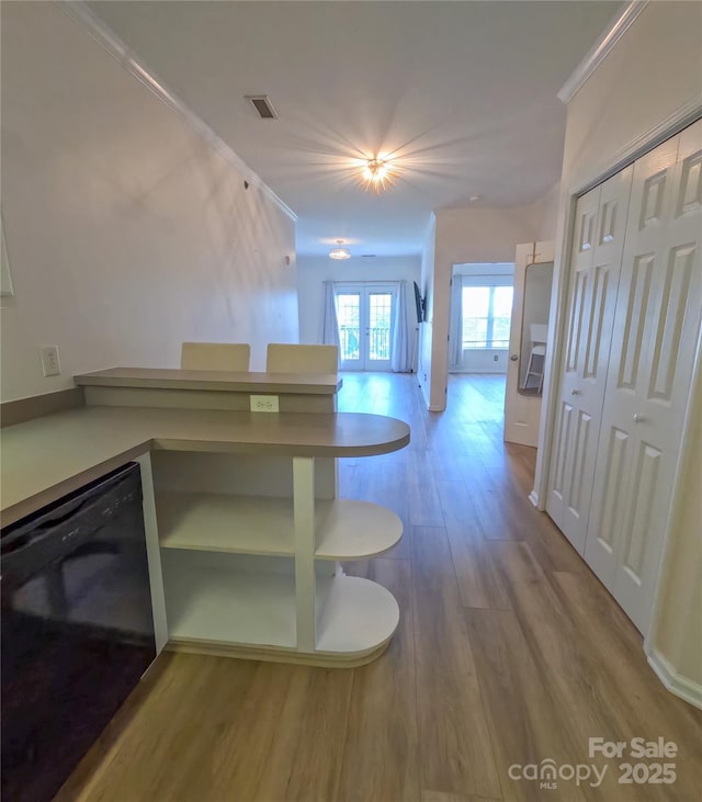 1410 4th Street Dr NW Unit 303, Hickory, NC 28601 - unfurnished dining area featuring wood finished floors and french doors