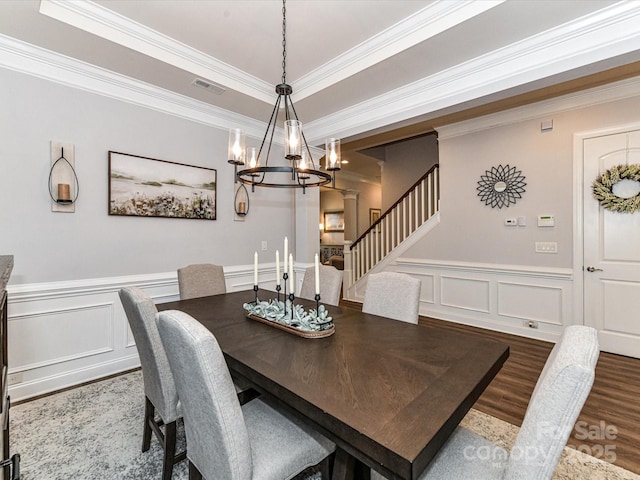 2005 Arbor Hills Dr, Indian Trail, NC 28079 - dining space with a chandelier, wood finished floors, ornamental molding, stairway, and a wainscoted wall