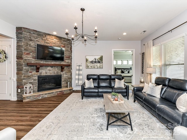 2005 Arbor Hills Dr, Indian Trail, NC 28079 - living room featuring a fireplace, wood finished floors, a chandelier, and recessed lighting