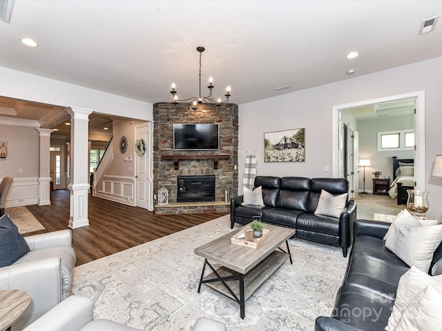 2005 Arbor Hills Dr, Indian Trail, NC 28079 - living room with ornate columns, wood finished floors, a fireplace, recessed lighting, and a decorative wall